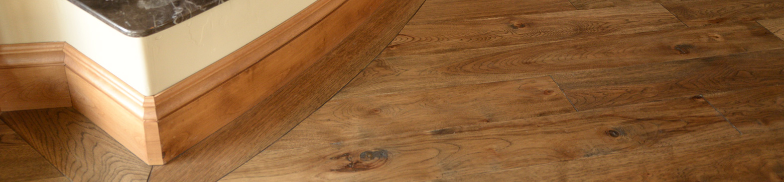 photo of custom baseboards hickory hardwood floor